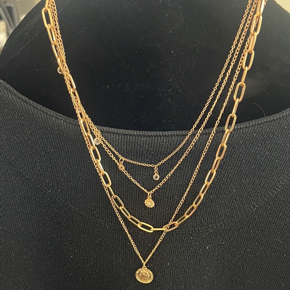 Jewelry - Gold-Tone Layered necklace with Queen Elizabeth coin and charms.